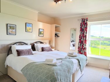 Bright bedroom with lovely countryside views to wake up to