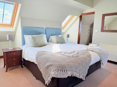 Cosy bedroom tucked under the eaves for a peaceful night&rsquo;s sleep