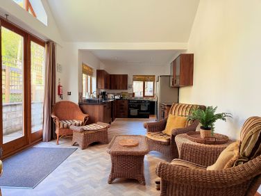 Relaxed lounge with comfortable seating and countryside views
