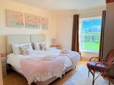 Bright double bedroom with countryside views and a peaceful feel