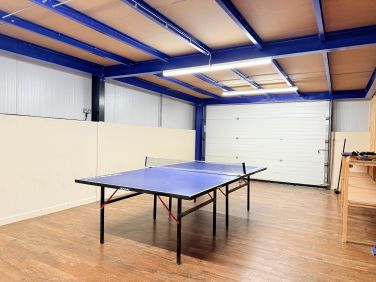 Shared games room with table tennis for relaxed group fun