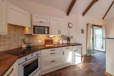 Large kitchen with all mod cons for dining in or on the deck