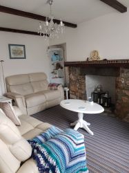 Driftwood lounge with 2 reclining sofas and gas stove