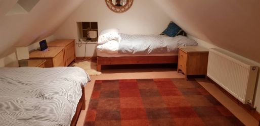 Twin bedroom in the eaves, with low ceilings