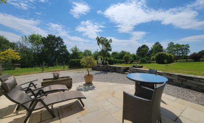 The Cottage patio overlooking gardens and fields