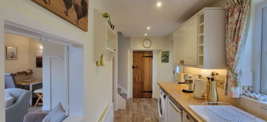 Kitchen with pantry/shoe and coat store