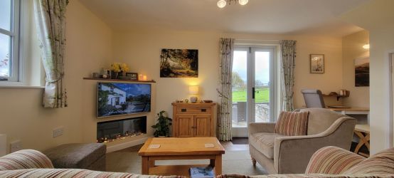 Seating area with separate dining area by French windows