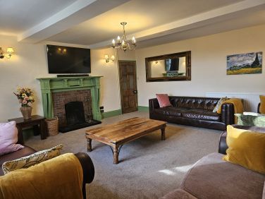 Comfy lounge with large 54 inch smart TV and samsung sound bar