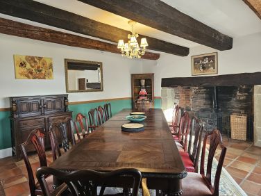 Inglenook fireplace with log burner in the dining room