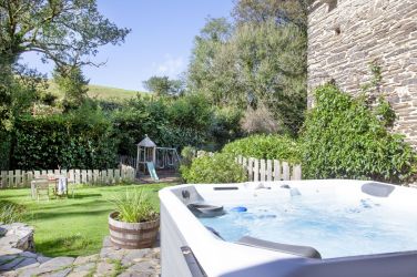 Fletchers Combe Barn Garden - hot tub w/ two BBQ's, fire pit, outdoor seating, playground