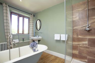 Farmhouse, Upstairs - shared bathroom w/ shower, roll top bath, toilet, sink