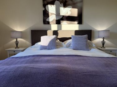 Master bedroom with super king sized bed