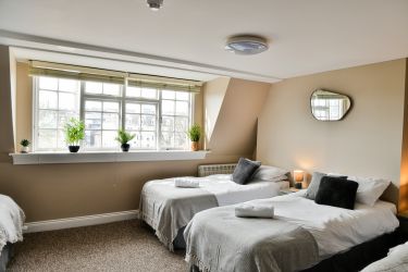 Homely bedroom on the sixth floor with six single beds and en-suite bathroom