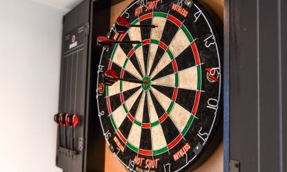 Dart board in the breakout and breakfast room
