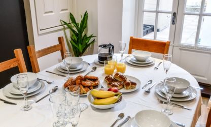 The breakfast room located in basement next to the kitchen is a lovely small dining space