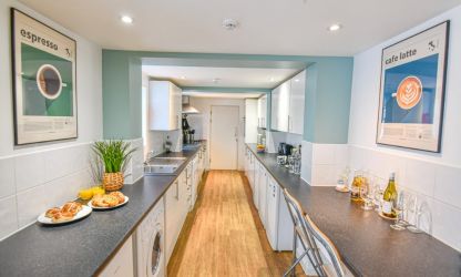 Large self-catering kitchen located in the basement, with adjoining breakfast room