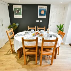 The breakfast room located in basement next to the kitchen is a lovely small dining space