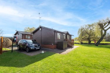 Parking next to the lodge for two cars