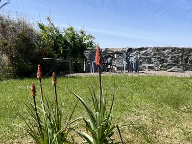 Extensive secluded back garden leading to patio and views of the Moray Firth