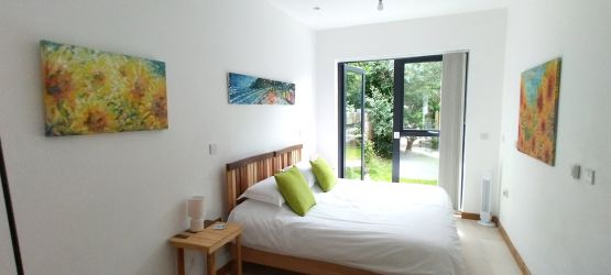 Bedroom with door to patio