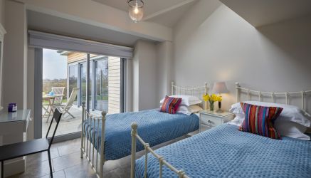 Both Bedrooms Have sliding Windows Opening Onto South Facing Terrace