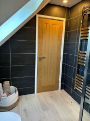 Heated towel rail. Ceramic tiled flooring and underfloor heating throughout