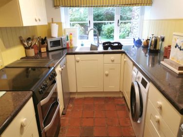 Ample Kitchen with working appliances.