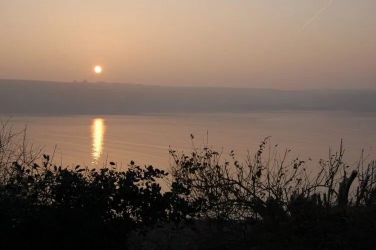 Watch the sunset over the water from the garden