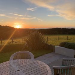 Sunsets from both Cottage Patios