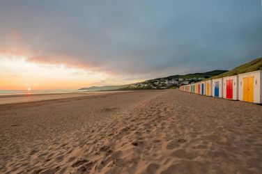 Woolacombe Beach offers 3 miles of soft sand, with beach huts available for hire