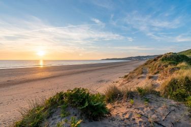 The dunes behind Woolacombe Beach offer access to the legendary South West Coast Path