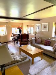 Lounge area with Baby Grand Piano
