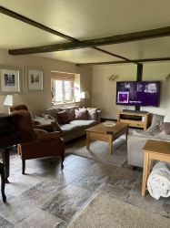 Lounge area with large TV