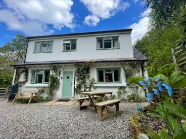 Parking for two cars includes a 7.5kw EV charger located right at the front of the cottage.