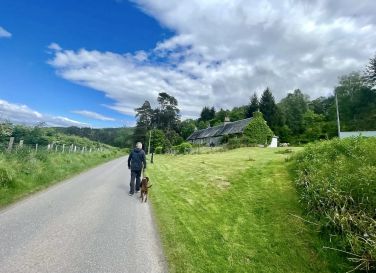 Returning to the cottage through the village of Tomich, enjoying the scenic local surroundings.