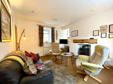 The rear lounge overlooks a wildlife area where pine martens and badgers visit for nightly feeding.