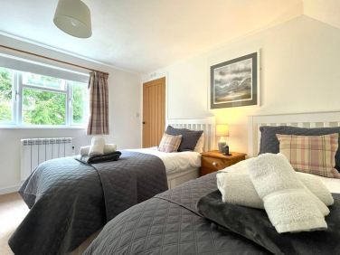 The twin room overlooks the rhododendron bank, where red squirrels frequently come to feed.