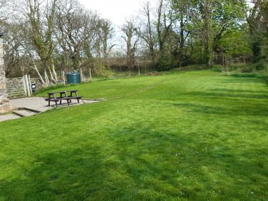 The cottage garden, fully enclosed, large lawn and picnic bench