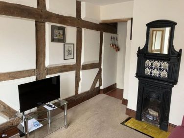 Sitting Room showing beams of earlier Tudor house