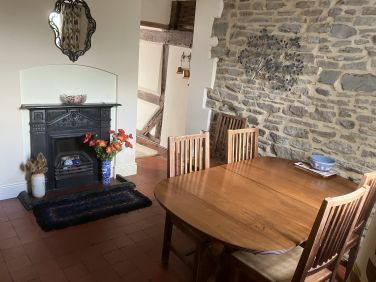 Dining room with medieval stone wall