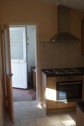 Kitchen out to small back porch.