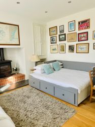 Downstair double bedroom with fire place and view over the garden