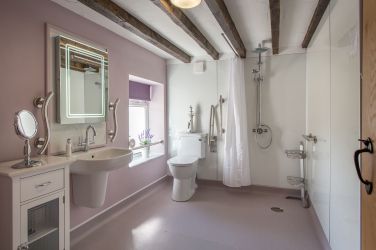 Modern accessible family wet room with luxury rain shower.