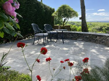 Space to relax under the dappled shade of the trees.