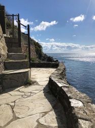 The south facing lower patio affords the closest proximity to the sea.