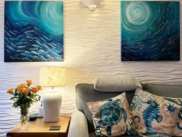 The sea theme carries through the furnishings and original art.