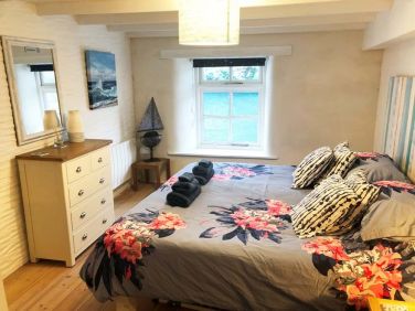 Large Super King bed with sea views.