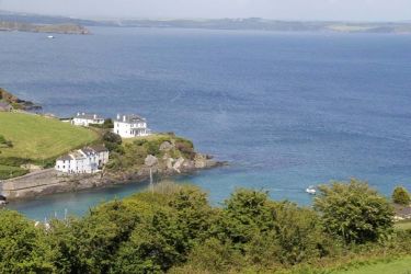 Looking down into Portmellon and the cottage from the hill behind.