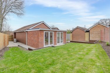 Rear garden showing lawn area, patio area and secure fencing.
