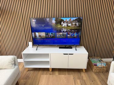 The lounge area features Sky TV.